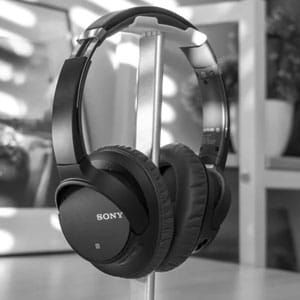 Wireless Sony headphones on a stand, premium audio gear, quality sound, noise-canceling headphones, modern tech accessories, headphone image for electronics store, EGS Pakistan.